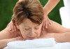 Senior woman on a massage bed